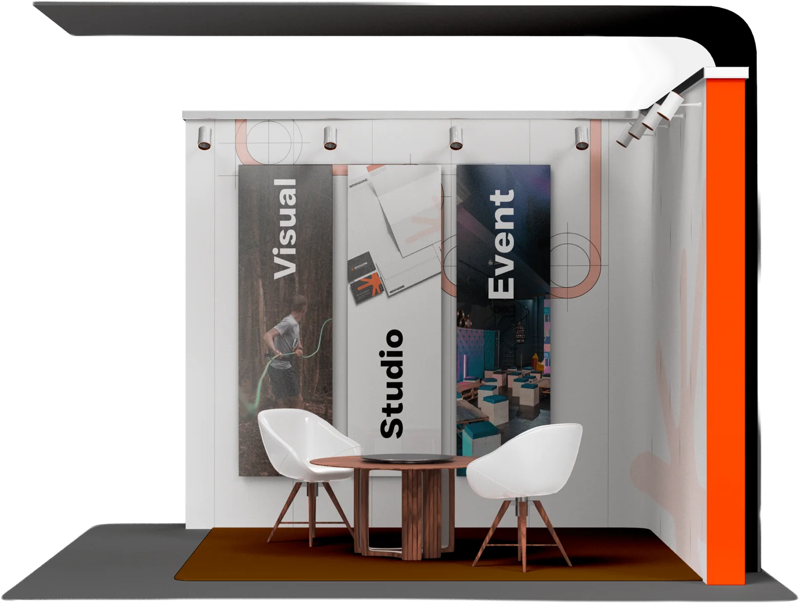 Un stand de salon habillé : trois panneaux, une table, deux fauteuils